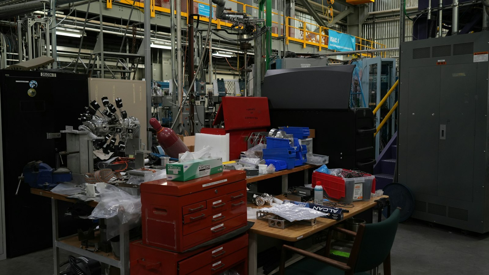 A cluttered workbench in a busy laboratory or workshop