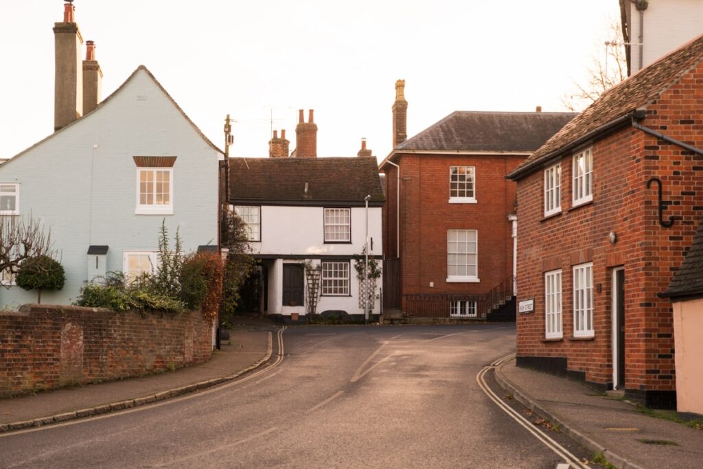 England’s Average House Price Hits £293,262 as Annual Growth Holds at 2% Row of English houses of different types including detached, semi-detached, terraced and flats